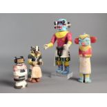A group of four Hopi Kachina dolls, Arizona, carved wood and brightly painted, the largest 26.5cm