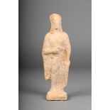 A Greek terracotta standing female, with headdress and robe, c. 5th century B.C., 15cm high.
