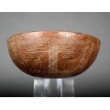 A Marquesas Islands bowl, wood with carved geometric decoration divided into eight panels, each with