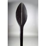 A Solomon Islands paddle club, Melanesia, with a leaf shape blade and medial ridges, with an