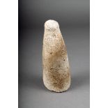 An Oceanic coral pounder, of tapering cylindrical form with a slightly knopped handle, 19.5cm high.