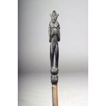 A Lake Sentani lime spatula figure, West Papua, 18.5cm high, on a stand. (2)