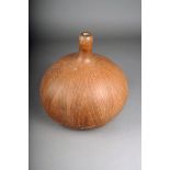 A 19th century calabash, with linear decoration, 30cm high.