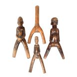 Four Lobi catapults, Burkina Faso; three with figural handles and the fourth with an incised band