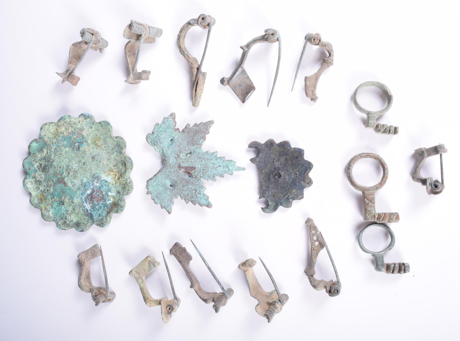 Eleven bronze brooches, with sprung pins, possibly Roman, three Roman bronze key finger rings and - Image 2 of 2