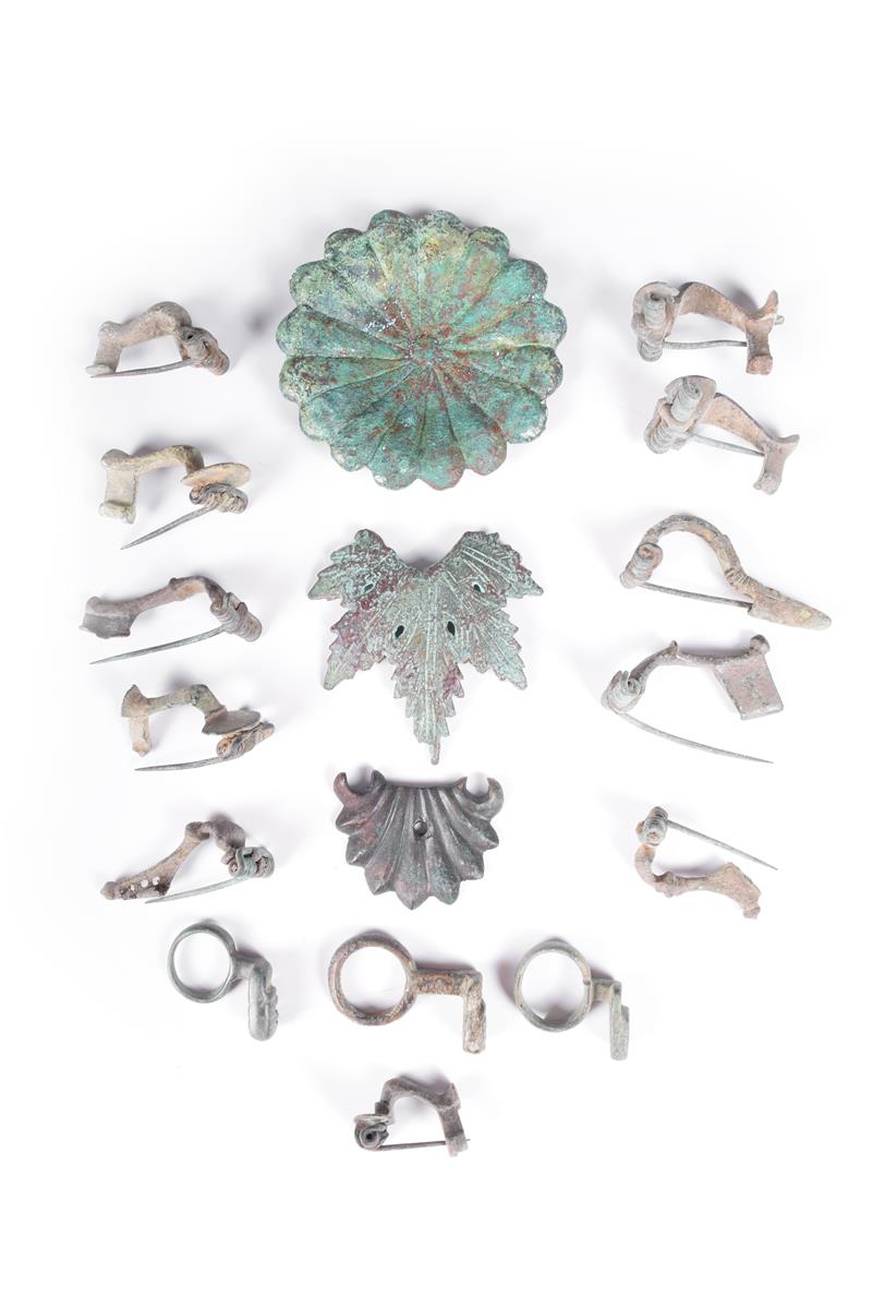 Eleven bronze brooches, with sprung pins, possibly Roman, three Roman bronze key finger rings and