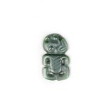 A Maori nephrite hei-tiki pendant, with right hand on chest, pierced attachment aperture, 7cm