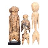 A Moba figure, Togo, of simple human form, 17.5cm high, on a stand, and two Moba similar figures,