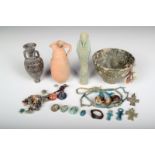 An Egyptian faience shabti, 10.5cm high, a green glazed pottery bowl, a faience bead necklace,