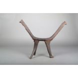 A Tikopia headrest, Melanesia, carved wood in three parts, the uprights with a ridge of nodules to