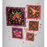 Five Batak needlework wedding pillows, Indonesia, square with floral designs and bead borders, the