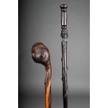 A Tanzanian hardwood cane, carved a Makonde head with a serpent, 91.5cm high and a root wood club,