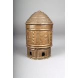 An Ashanti brass container, kuduo, embossed and engraved with bird and geometric decoration, with