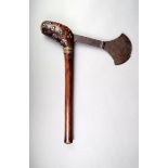 An Ila axe, Zambia, wood with brass interlaced wirework and studs with an iron crescent blade,