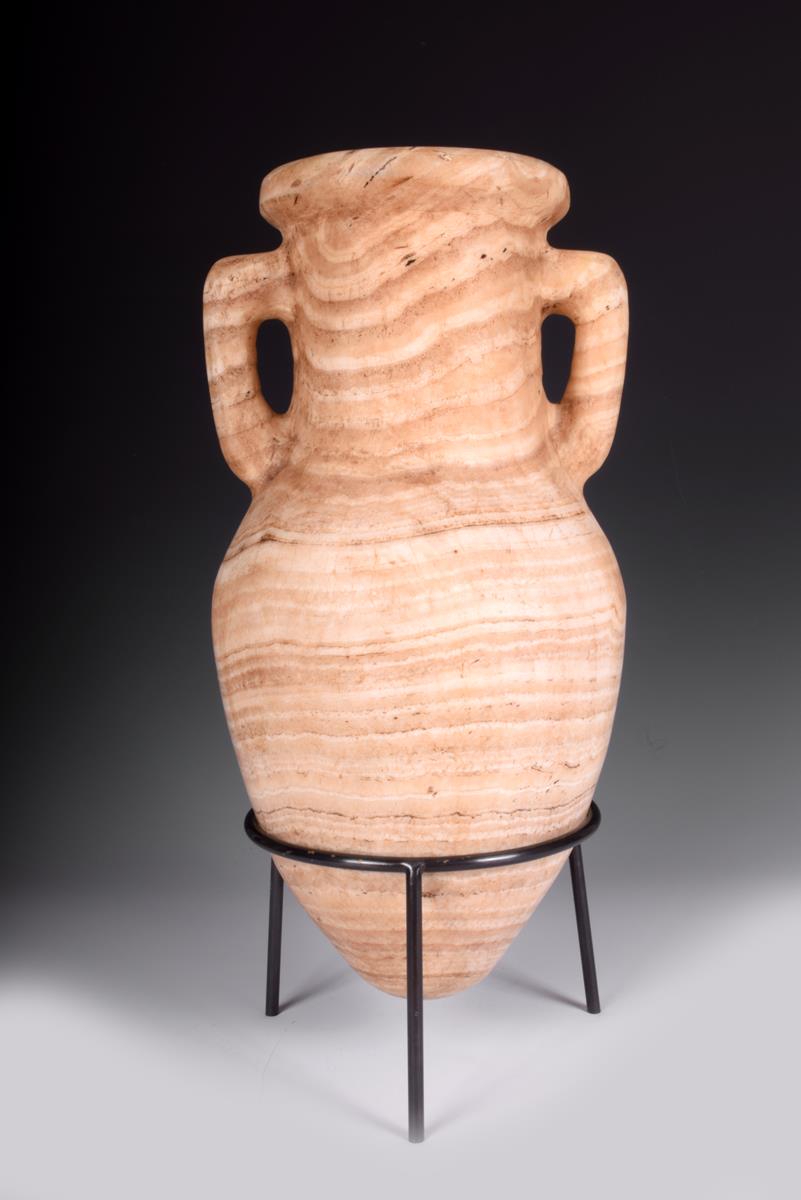 An alabaster amphora, 45cm high, with a stand. (2)