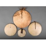 λ  Four Solomon Islands kap kaps, breastplates, shell disks with fibre, the smallest with turtle