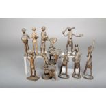 Ten brass figures, Ivory Coast, including a pair with baskets and three playing drums, 18.6cm the