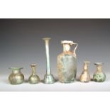 A Roman turquoise glass jug, with strap handle, 15.5cm high, an unguentarium with slender neck and