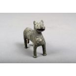 A Elamite bronze feline animal, with a pierced panel chest and scroll tipped tail, 6.5cm high.