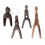 A Lobi catapult, Burkina Faso, with a standing male figure handle, 19cm high, a Lobi catapult with a