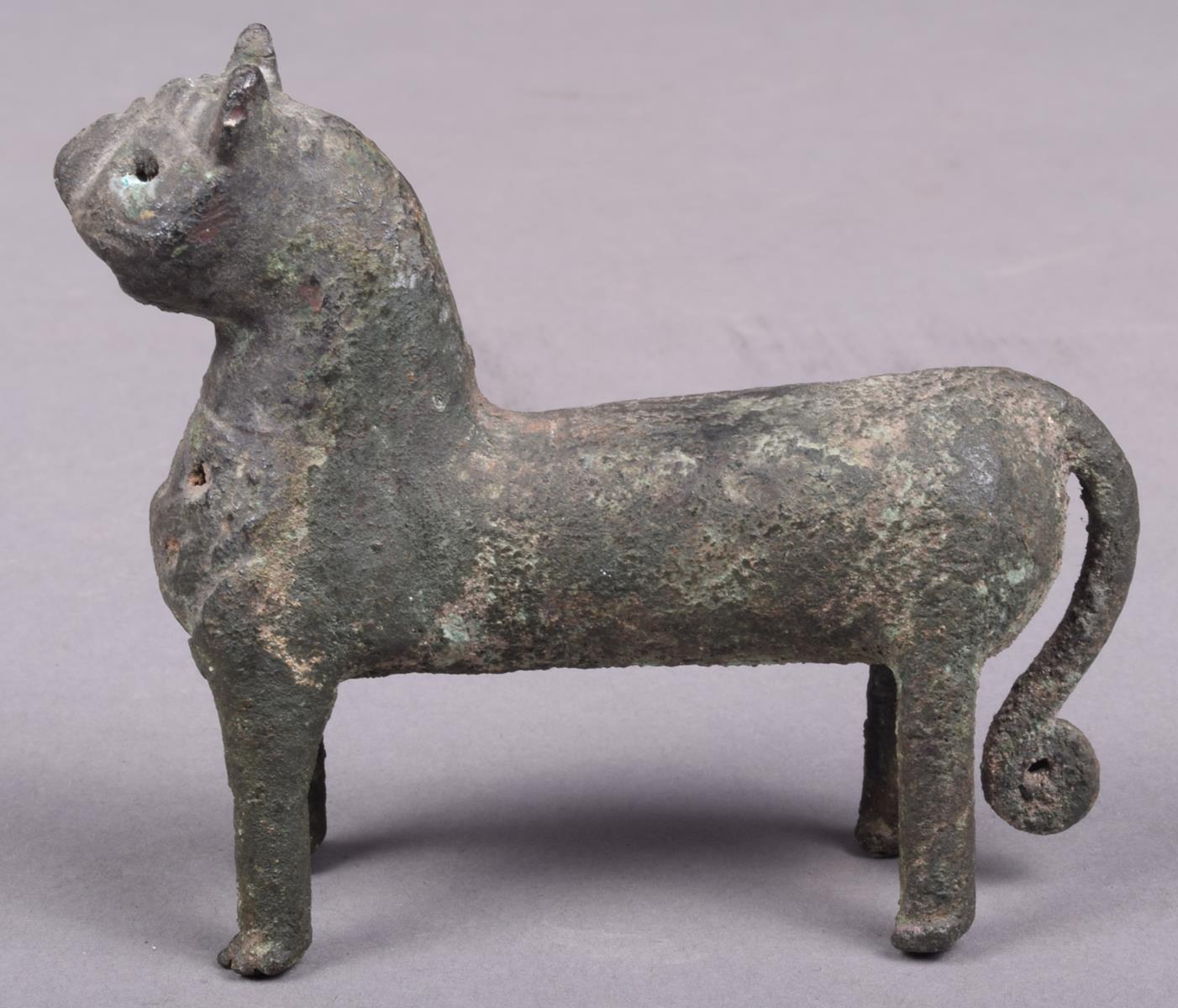 A Elamite bronze feline animal, with a pierced panel chest and scroll tipped tail, 6.5cm high. - Image 3 of 5