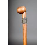 A Zulu staff, South Africa, with an off centre flattened spherical finial and with two wirework