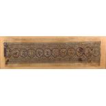 An Egyptian Coptic textile fragment, linen and wool, with a central band of roundels depicting