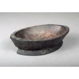 A Solomon Islands bowl, wood of eliptical form with two pierced suspension holes to the foot, with