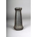 A Northwest Coast black stone pounder, of spool type, 16.5cm high. Provenance Dr James Spillius,