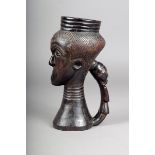 A Kuba anthropomorphic cup, D.R. Congo, carved a head and figural handle, 24cm high.