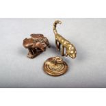 Three Akan brass gold weights, Ivory Coast; a leopard, 5cm long, a coiled snake, 2.7cm diameter, two