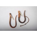 A Northwest Coast fish hook, bentwood, bone and fibre, 17cm high and another, similar, 15.5cm