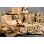 A collection of woven fibre baskets, Tonga, Fiji, New Hebrides, of varying styles, with handles