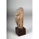 An Oceanic carved stone figure, possibly Papua New Guinea, 18cm high, with stand. (2)