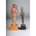 A bronze figure of Osiris, Egypt,12.2cm high, on a wood base and a wooden shabti, polychrome