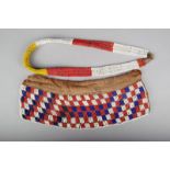An East African beadwork waistband, 72cm long and a rectangular panel, padded cloth and beads, 33.