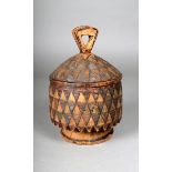 A South African carved wood pot and cover, with incised triangular decoration, the cover with a