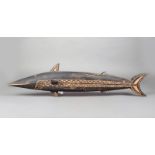 A Solomon Islands carved wood bonito fish, with incised decoration, 83cm long. Provenance Dr James