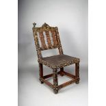 An Ashanti chair, Ghana, hardwood with brass studs, with a pierced triple splat back and leather