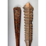 A Samoa club, Polynesia, with carved faceted nodules to both sides, 80cm long and a Polynesia club