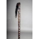A Batak magician's staff, carved figures, the reverse with reptiles, the terminal with gum and hair,