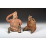 A Pre-Columbian pottery seated figural vessel, with hands behind his head on the rim, 14cm high