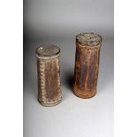 Two Oceanic cylindrical mortars, one faceted and carved nodules, the other with carved chevron