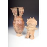 A Pre-Columbian pottery double neck vessel, with masks, 39cm high and a pottery standing figure,