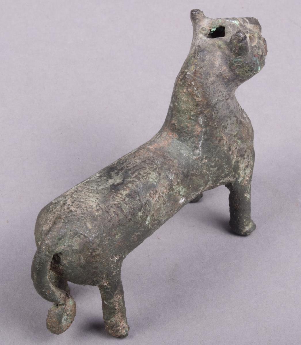 A Elamite bronze feline animal, with a pierced panel chest and scroll tipped tail, 6.5cm high. - Image 5 of 5