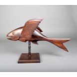 A Pitcairn Island flying fish, carved wood with applied eyes, one fin marked SOUVENIR FROM