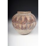 An pottery jar, with two chevron bands in red pigment, probably pre-dynastic Egyptian, 16cm high.