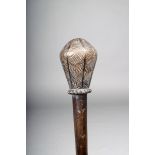 A Chokwe staff, Angola, with a pear shape head with incised band decoration, with a beaded collar,