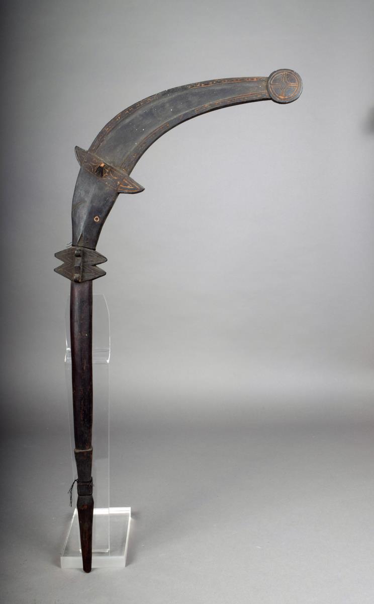 A San Cristobal dance wand, Solomon Islands, with a fish finial with roundel tail, inset shell eye