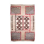 A Navajo rug, woven, boxes with geometric designs and feathers, 166 x 111cm. Provenance Mildred B
